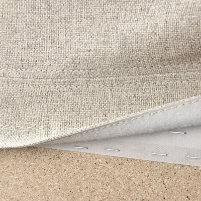 Close-up of VIMLE sofas washable, removable cover with hooks for easy maintenance.