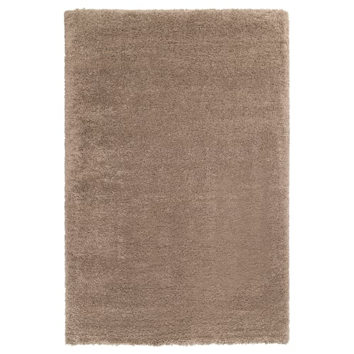 A light brown shaggy rug named VOLLERSLEV. Its soft and textured with long fibres, ideal for comfort.