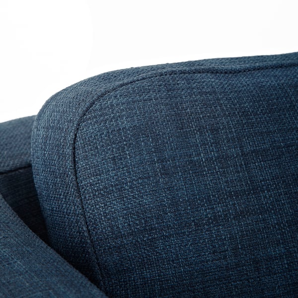 Colț de scaun tapițat albastru închis, care prezintă confort amortizat și cusături îngrijite pe un design modern elegant.