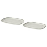 Două plăci ovale albe GLADELIG din gresie. Au un design simplu, elegant, cu un finisaj de glazură nisipoasă.