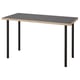 Un birou ikea LAGKAPTEN cu blat gri și picioare metalice negre. Designul său dreptunghiular, modern și minimalist.