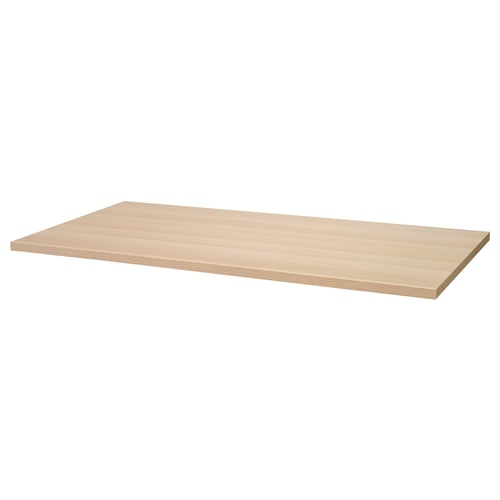 Un blat de masă IKEA LAGKAPTEN de culoare stejar deschis, formă dreptunghiulară, realizat din plăci de fibră cu umplutură de hârtie tip fagure și suprafață vopsită acrilică.