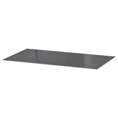 Un raft elegant, dreptunghiular din sticlă gri. Este plat cu margini călite, perfect pentru mobilier modern.