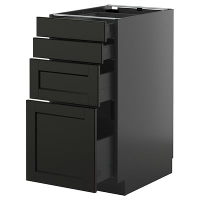 Sertar de frasin vopsit negru în dulap de bucătărie modern, cu margini teșite și design elegant.