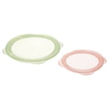 Două huse din silicon verde și roz. Sunt rotunde și reutilizabile, concepute pentru acoperirea și depozitarea alimentelor.