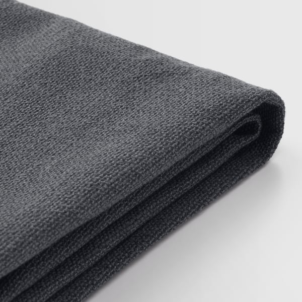 Textil gri închis pliat, probabil o husă de scaun lavabilă la mașină, afișată pe un fundal deschis.