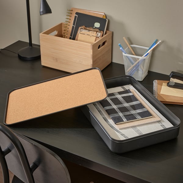 Desk with HARVMATTA organiser box holding notepads, a4/letter sizes, keeps workspace tidy.