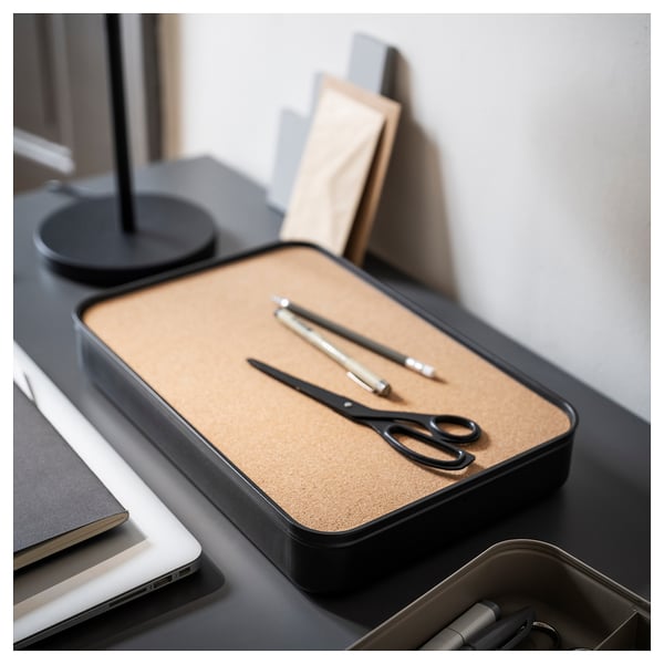 Tidy desk with HARVMATTA box, scissors, pens, lamp, laptop