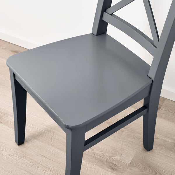 The INGOLF chair a smooth, durable seat and legs crafted from solid wood. Its sturdy design ensures long-lasting quality.
