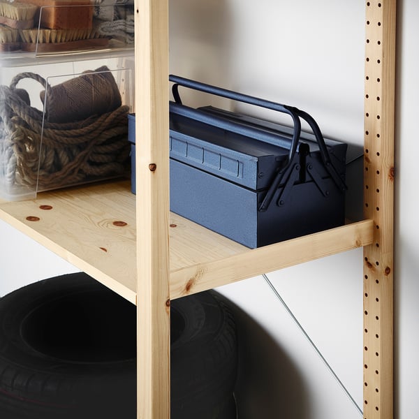 Wooden shelf unit with a metal toolbox and coiled rope. Robust storage solution for various spaces.