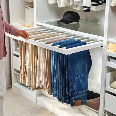 White KOMPLEMENT trouser hanger with grid design for organised storage.