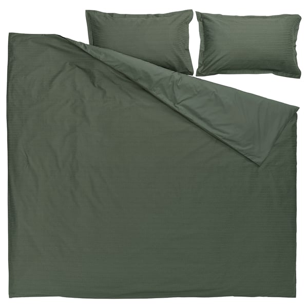 Dark green bedding set with waffle texture, includes duvet cover and two pillowcases, made from 100% soft cotton, laid flat.