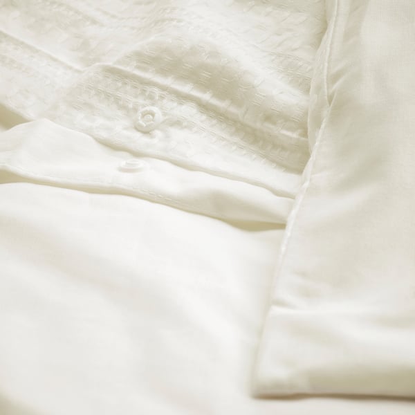 White waffle-weave duvet set with button closure, showcasing soft, breathable cotton texture.