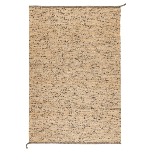 A handmade MELHOLT rug with natural jute and wool fibres, featuring random dark wool specks for unique texture and colour variation.