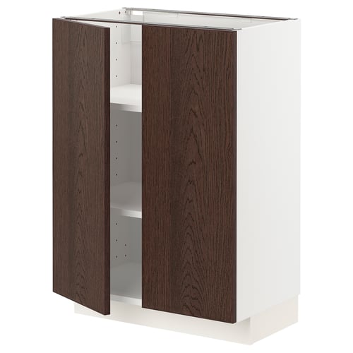 A white METOD kitchen cabinet with dark brown sinarp wooden doors, open to display a single adjustable white shelf inside.