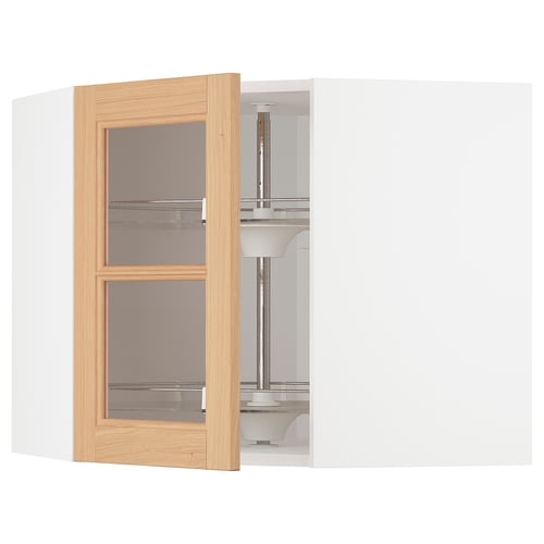A white METOD kitchen corner cabinet with an open oak-framed glass door.