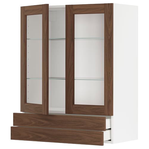 A white and brown wooden kitchen cabinet with glass doors and drawers.