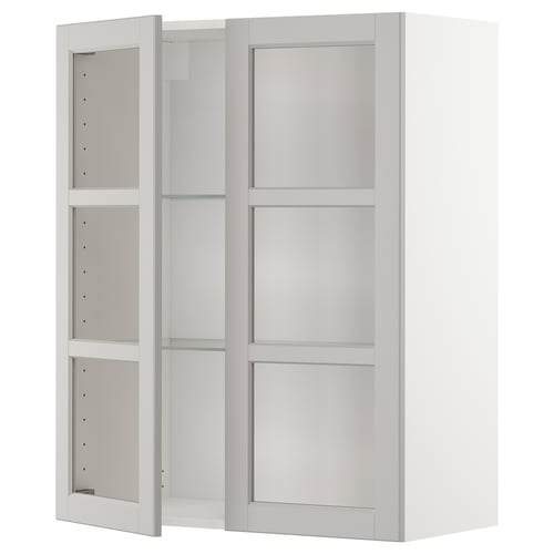 White METOD wall cabinet with glass doors, modern design.