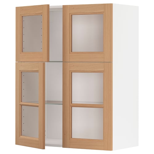 A METOD kitchen cabinet set. It four light oak frames with frosted glass doors. The set includes both shelves and closed compartments.