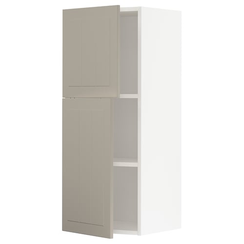 Beige METOD kitchen cabinet with two adjustable shelves.