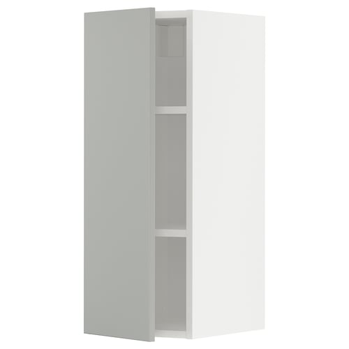 White METOD kitchen cabinet with light grey shelves.