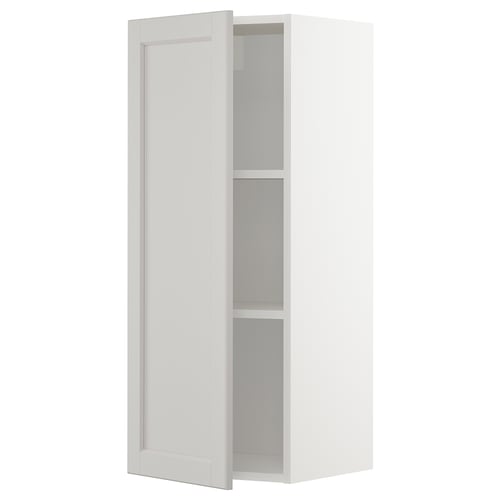 A white METOD wall cabinet with light grey lerhyttan doors, featuring a traditional design with bevelled edges and an adjustable shelf.
