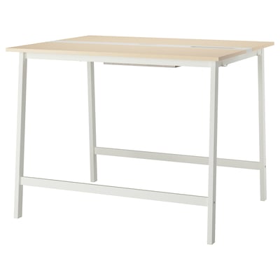 A MITTZON high conference table with a light beige top and white legs. Its designed for sitting or standing with a footrest for support.