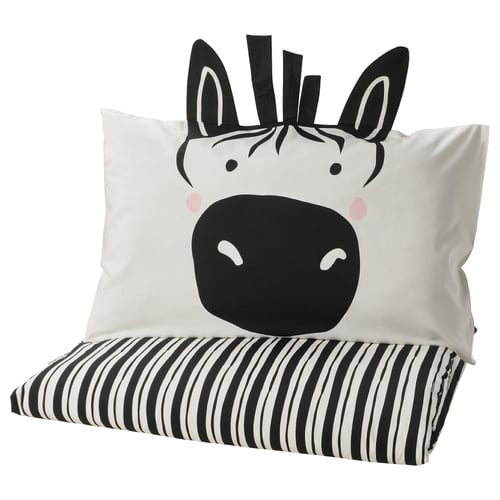 Cute zebra pillow on black-white striped cushion, soft, kids bedding.