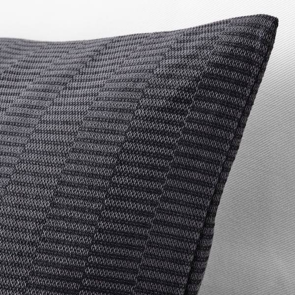 Close-up of a grey cushion cover, neatly sewn with a textured striped pattern, showcasing its high-quality cotton fabric and hidden zip.