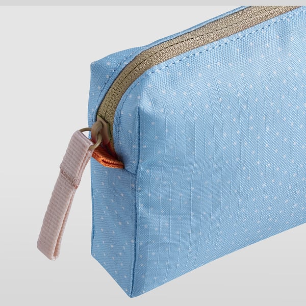 Light blue zip pouch with small dots. Pink wrist strap attached. Quality zippers, sturdy fabric.