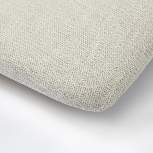 Close-up of woven, beige fabric with a soft, textured surface. Cushion appears plush and well-crafted.