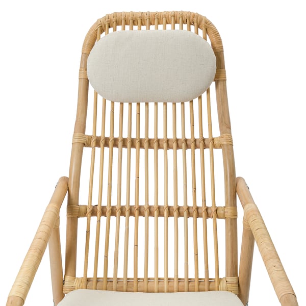 Rattan armchair with soft cushions. Comfortable seats and backs, woven for breathability.