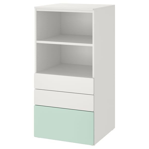 A white and light green SMÅSTAD bookcase with three sections: two open shelves at the top and three drawers at the bottom.