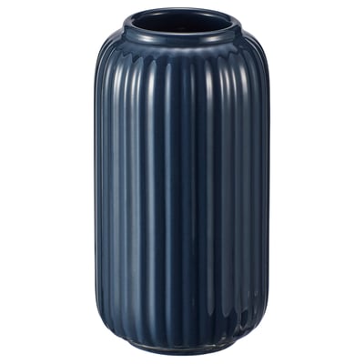 Depicts a blue STILREN vase made of stoneware with a coloured glaze, featuring a rounded cylinder shape and vertical ribbed design.