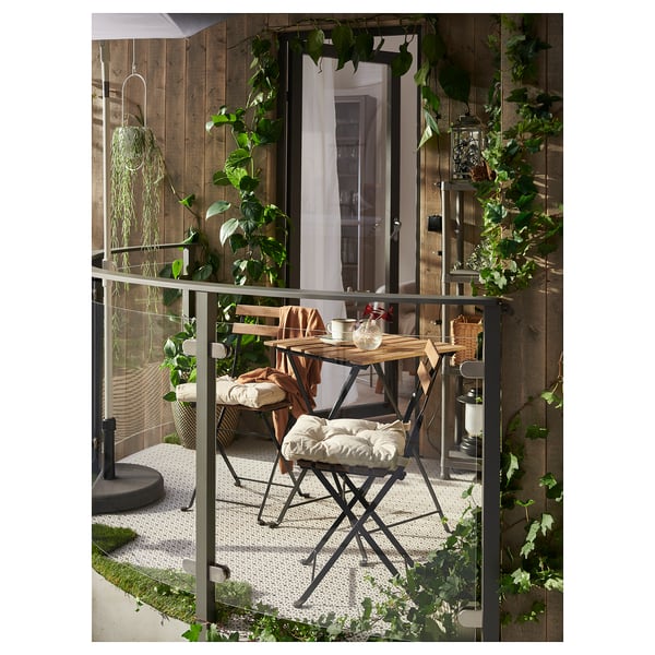 TÄRNÖ Table+4 chairs, outdoor, black/light brown stained foldable/foldable Kuddarna light grey-beige, 100x54 cm