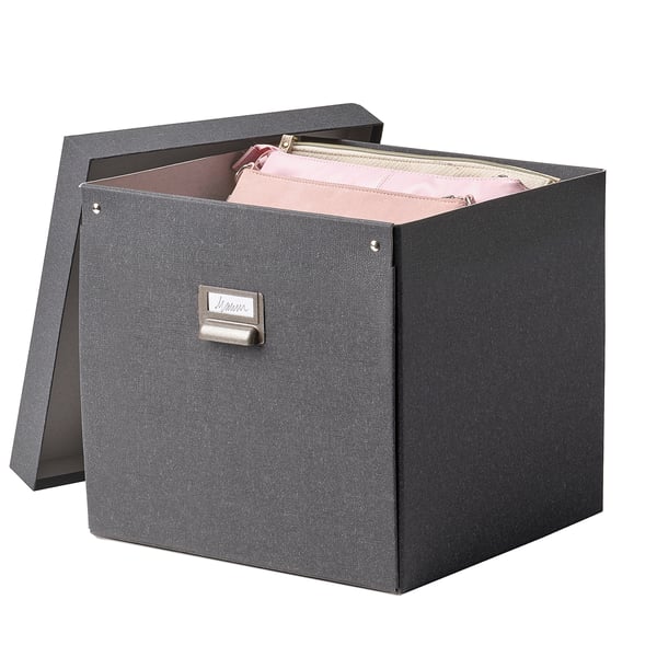A TJOG storage box, dark grey, rectangular with a lid slightly ajar revealing pink items inside, featuring a metal label holder.