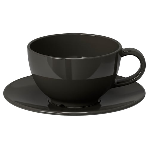 Black ceramic teacup and matching saucer; simple, rounded design, glossy finish.