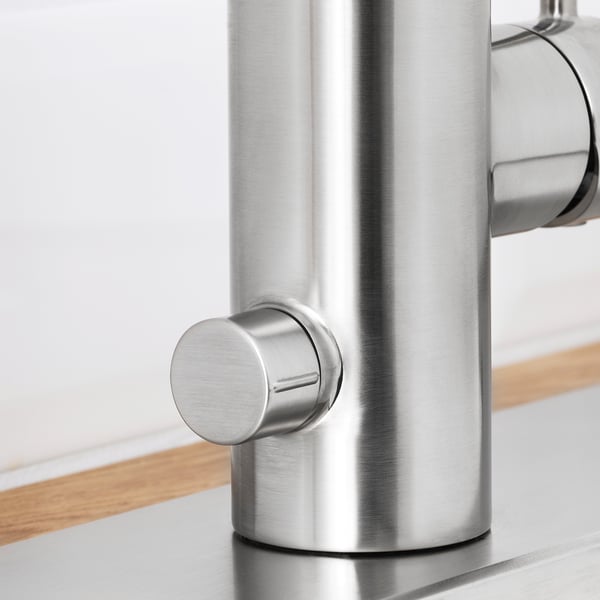 Close-up of sleek, high-quality metallic faucet, showcasing its modern design and durable material.