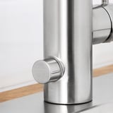 Close-up of sleek, high-quality metallic faucet, showcasing its modern design and durable material.