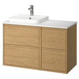 Modern wooden bathroom vanity in oak, featuring four drawers and a marble countertop with a square white sink and chrome faucet.