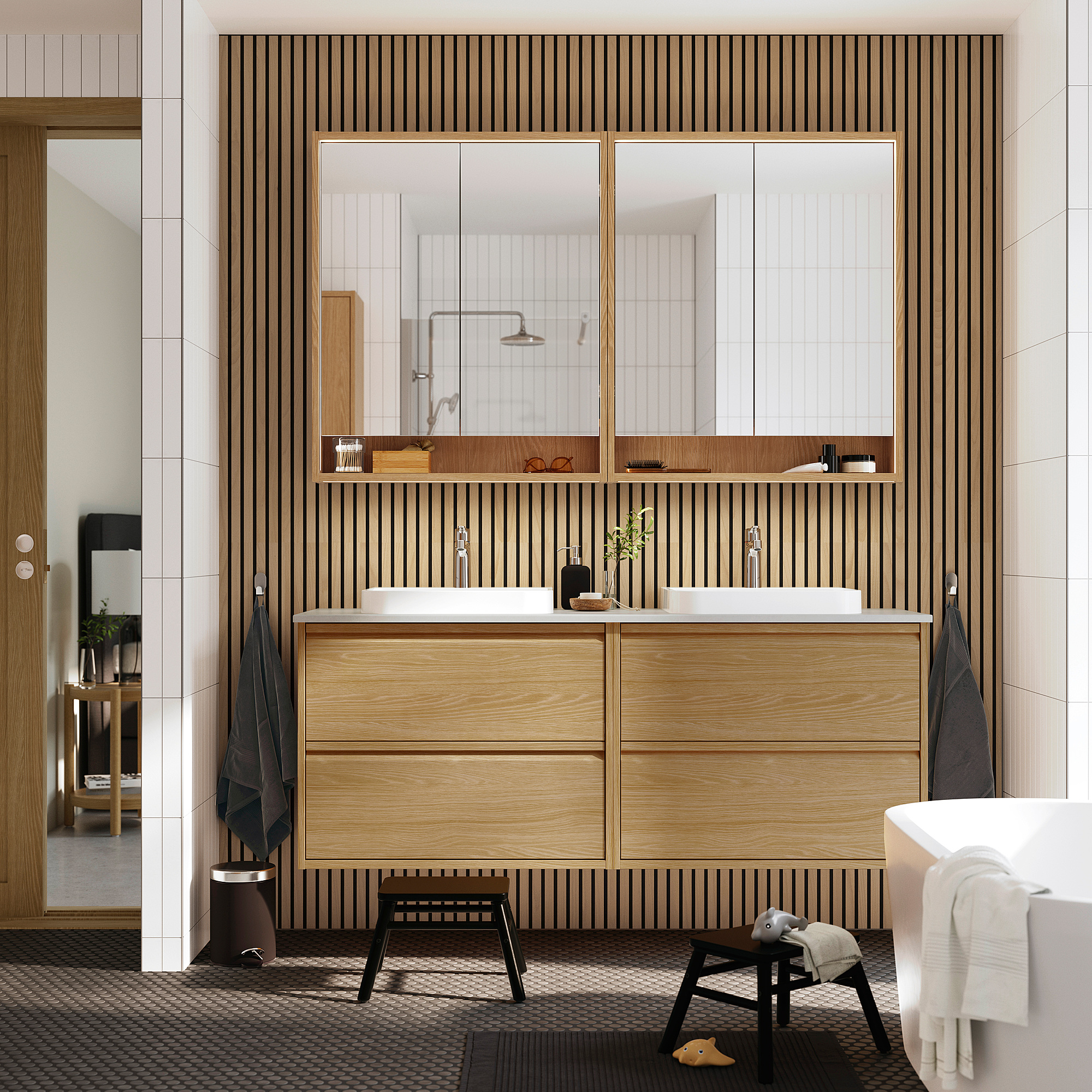 Modern oak ÄNGSJÖN double vanity with mirrors and towel hooks.
