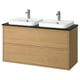 Double oak washbasin cabinet, modern minimalist design. Two white basins, chrome faucets, wall-mounted.