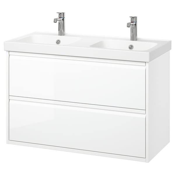 Its a white, wall-mounted dual sink bathroom vanity with modern design, two drawers, and chrome faucets.