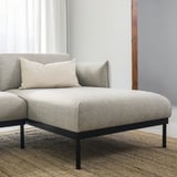 Modern grey fabric sofa with black metal legs. Neutral, cozy, and minimalist design.