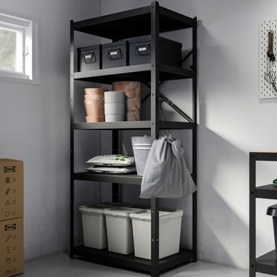 Black metal shelves with bins and bags organizing various items, maximizing storage space.