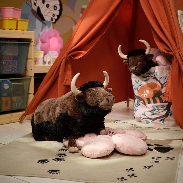 Two mammoth toys in orange play tent, one with pillow.