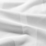 Elegant white curtains with subtle geometric pattern, soft texture, offering privacy and light filtration.