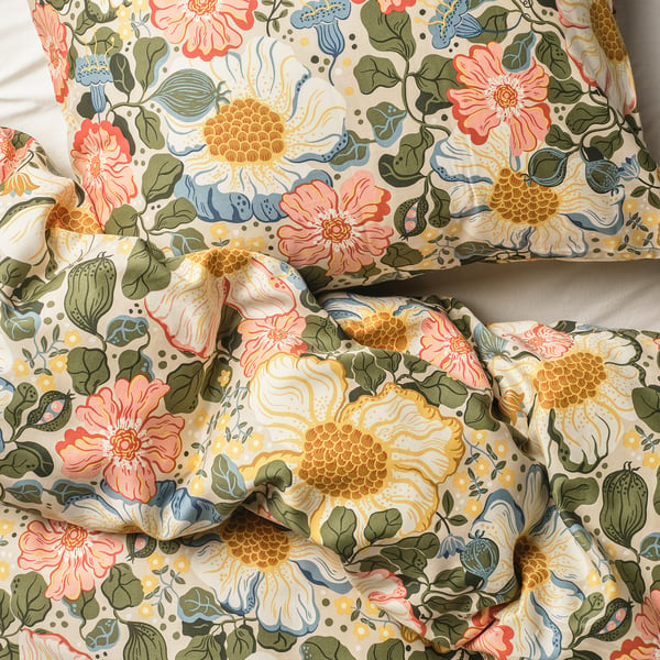 Floral bedding with silky sheen; vibrant flowers on cream, soft & luxurious.