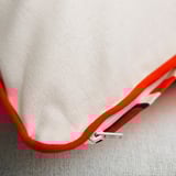 Cushion cover with hidden zipper for easy removal.