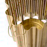 Gold-colored metal lantern with intricate punched hole designs and wavy edges, exuding a festive and elegant vibe.
